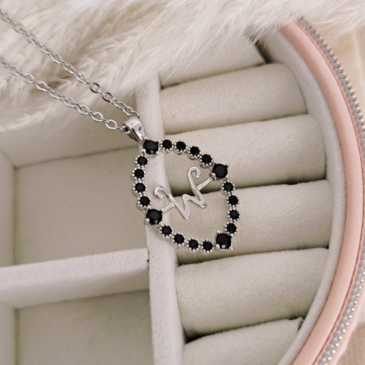 Collana talismano magico con iniziale girevole