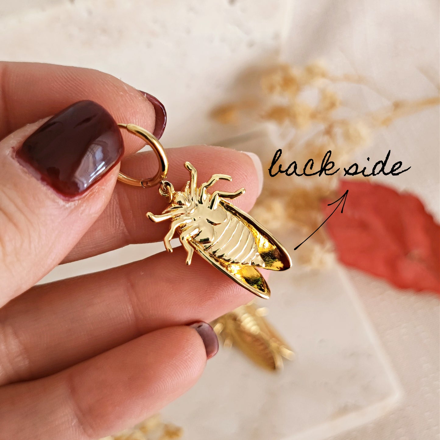 "Cicada" golden earrings