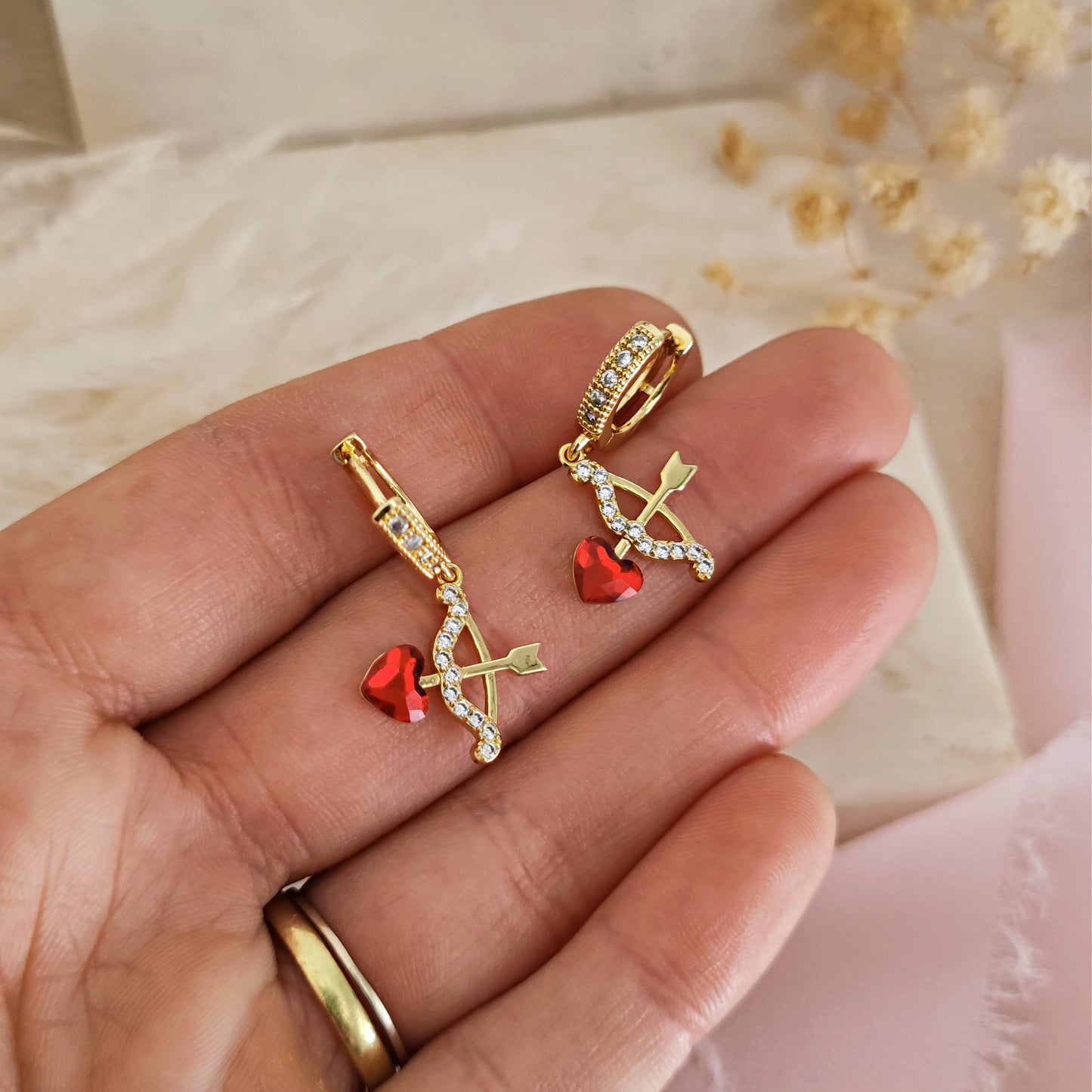 "Tenderly" micro hoop earrings with heart bow and arrow, gold