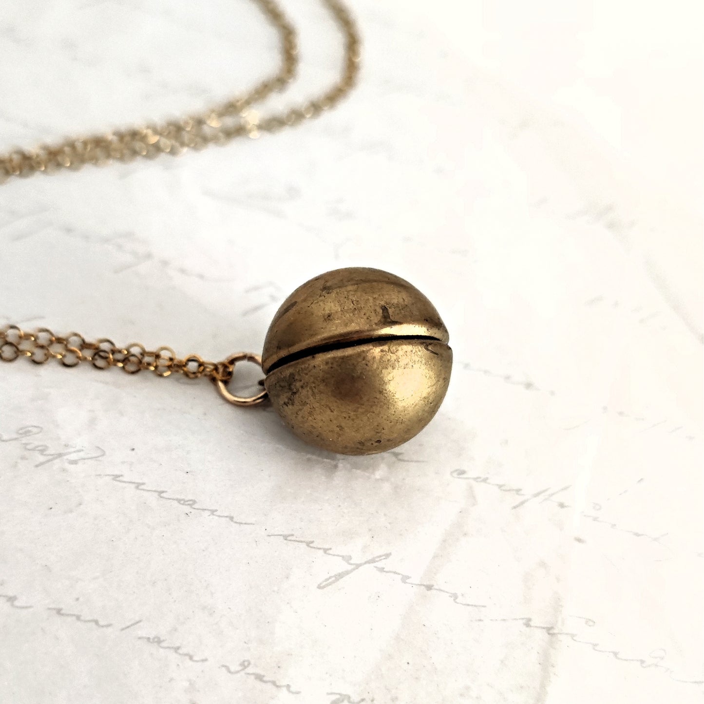 Vintage spherical photo frame in natural brass