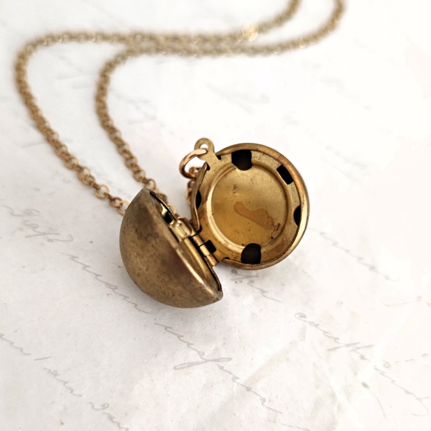 Vintage spherical photo frame in natural brass