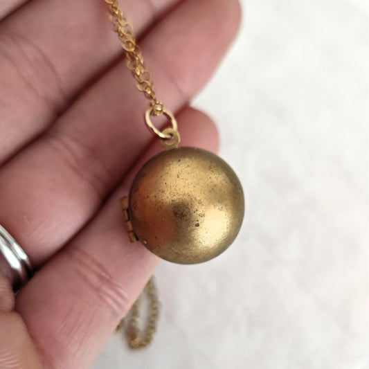 Vintage spherical photo frame in natural brass