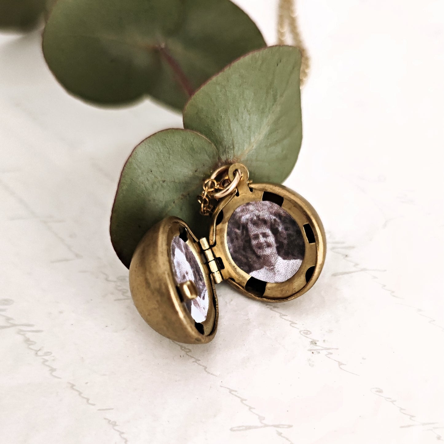 Vintage spherical photo frame in natural brass