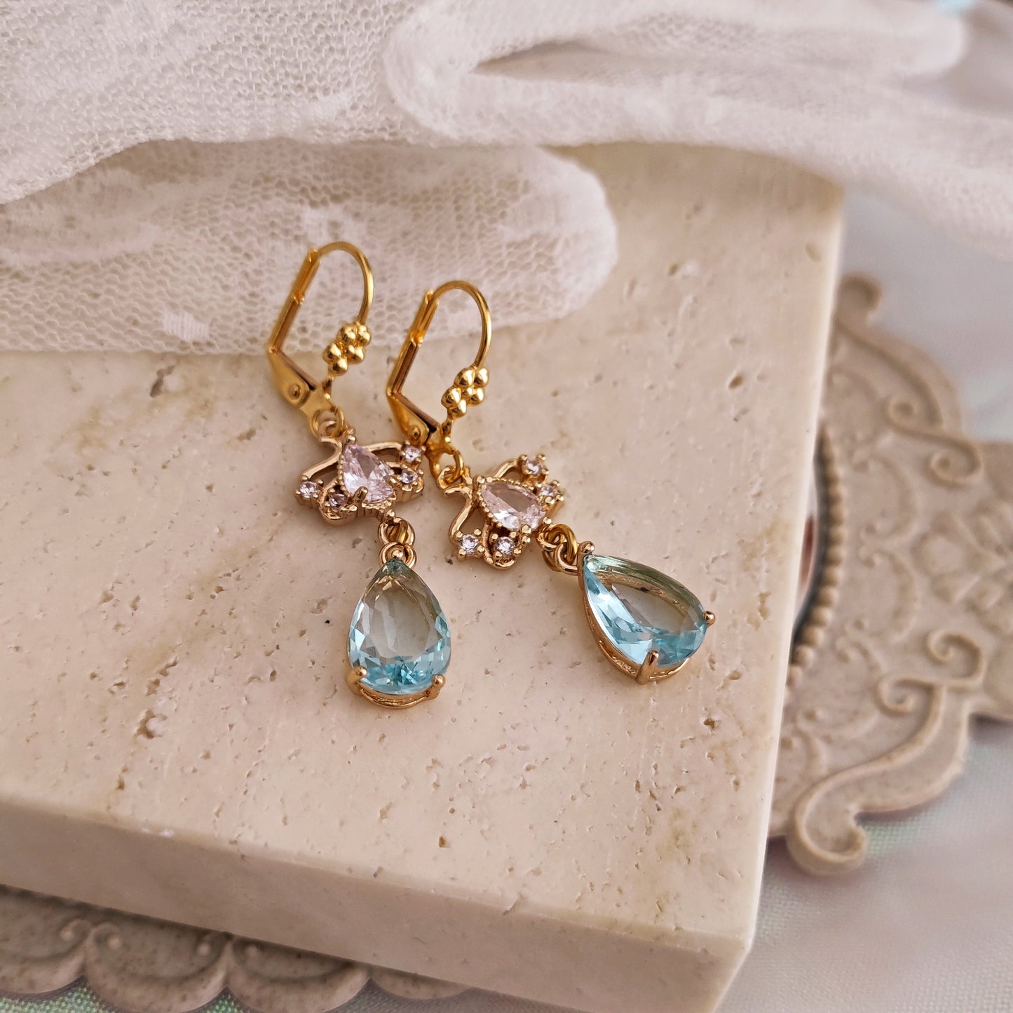 "Daphne" earrings with blue teardrop crystals