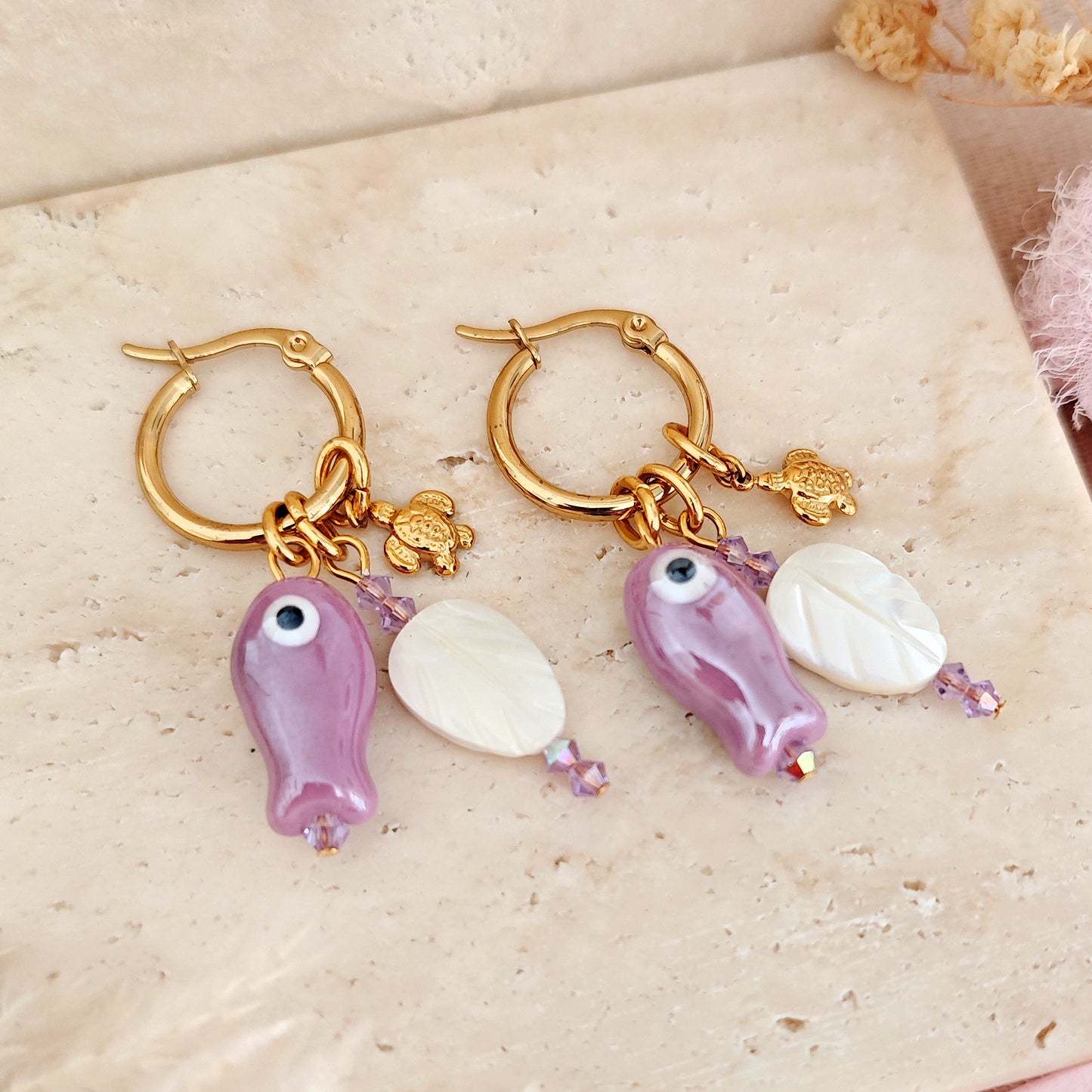 "Coastal Aura" earrings with ceramic fish, mother-of-pearl leaves, and turtles