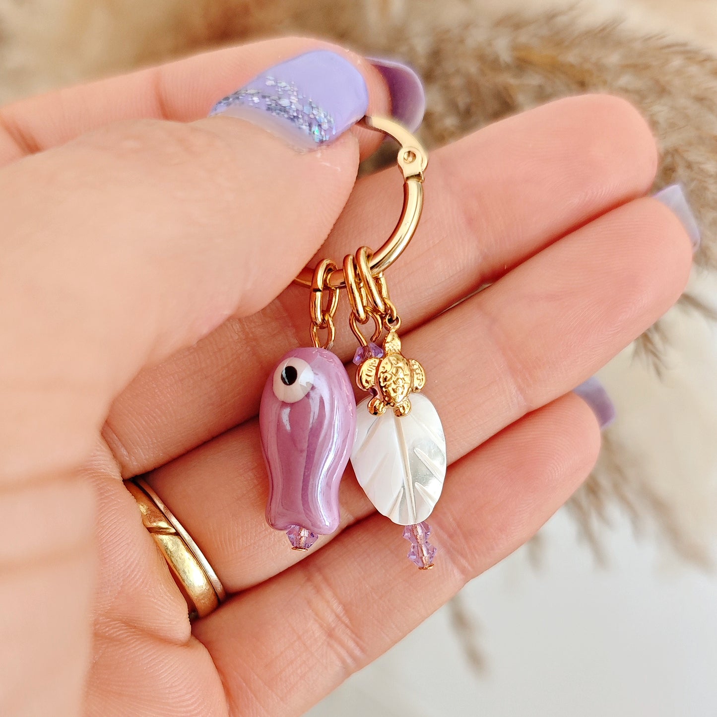 "Coastal Aura" earrings with ceramic fish, mother-of-pearl leaves, and turtles