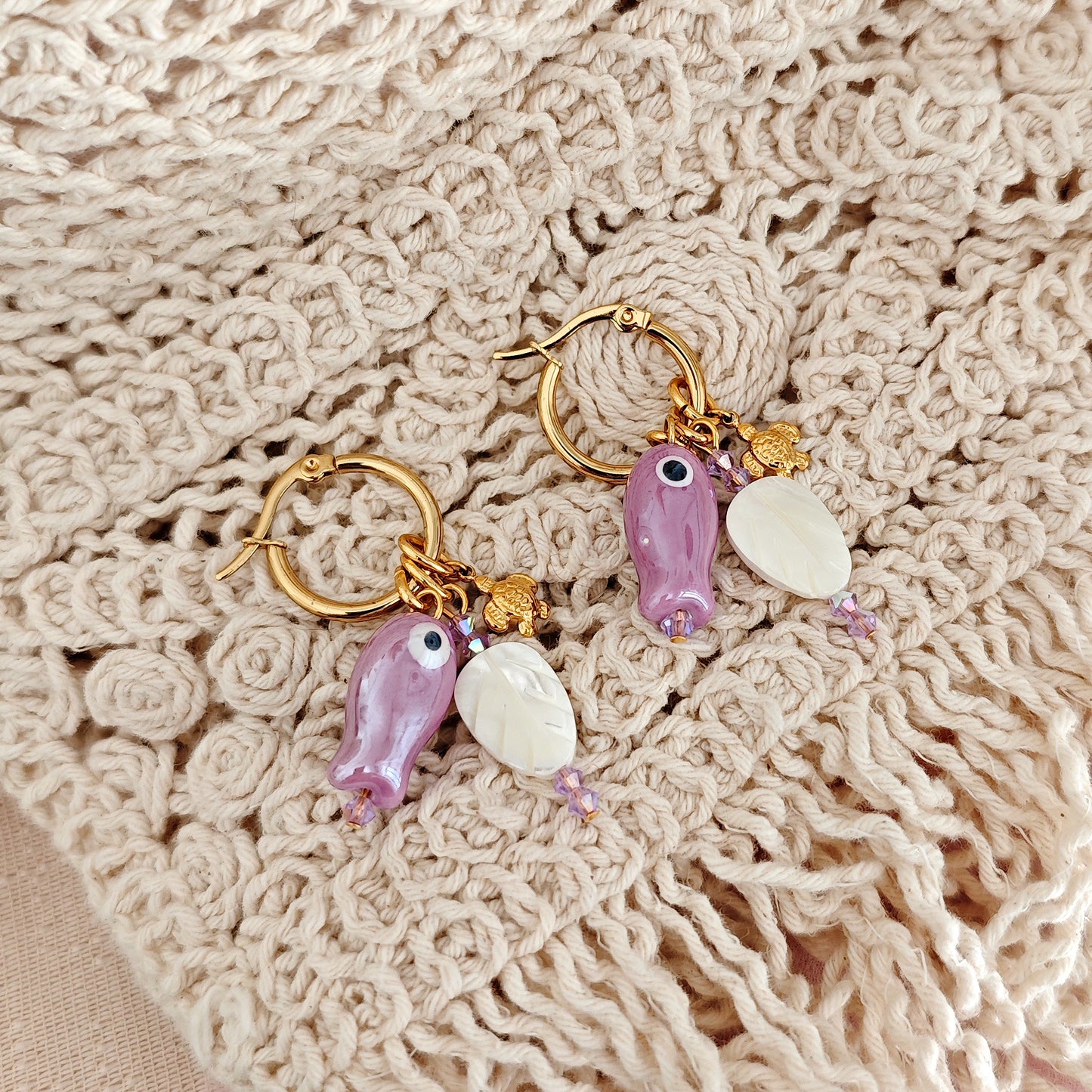 "Coastal Aura" earrings with ceramic fish, mother-of-pearl leaves, and turtles