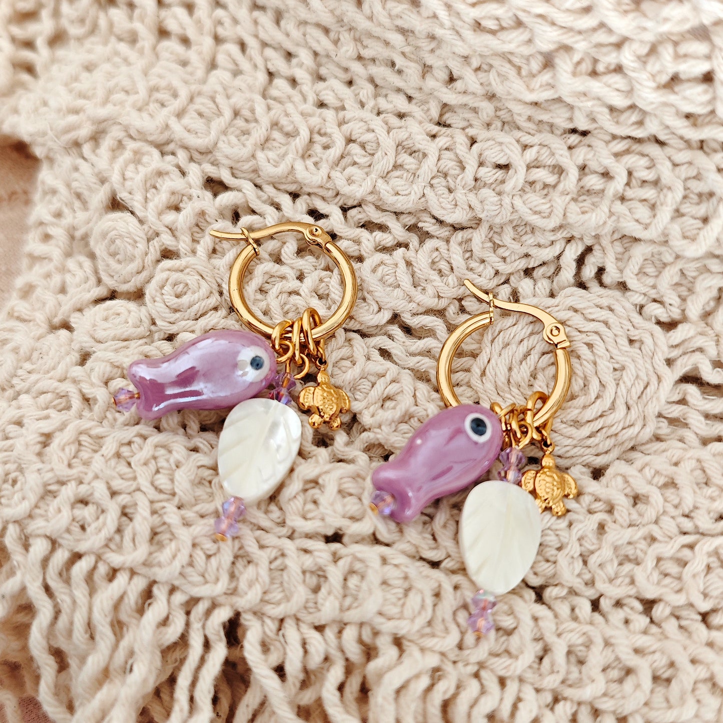 "Coastal Aura" earrings with ceramic fish, mother-of-pearl leaves, and turtles