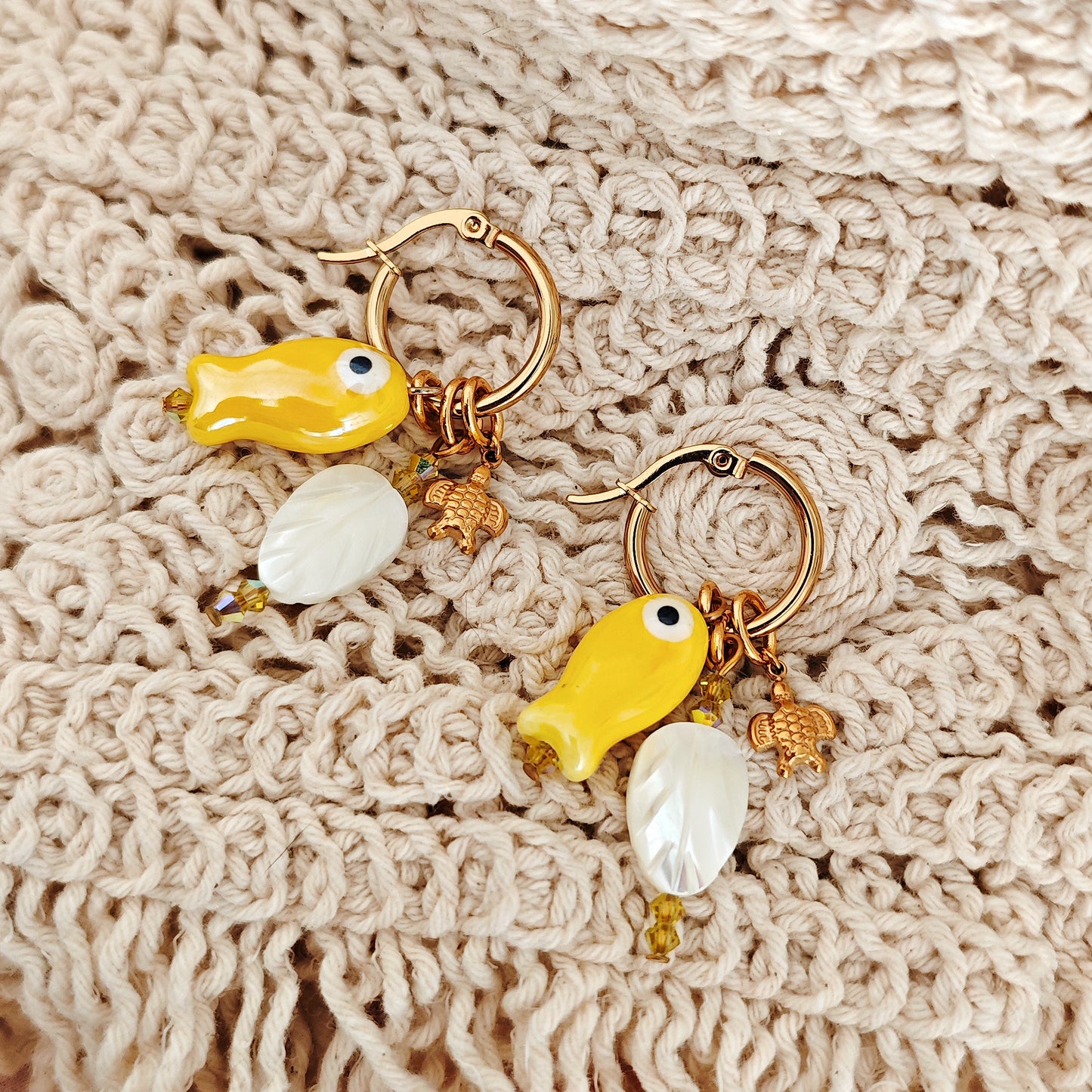"Coastal Aura" earrings with ceramic fish, mother-of-pearl leaves, and turtles