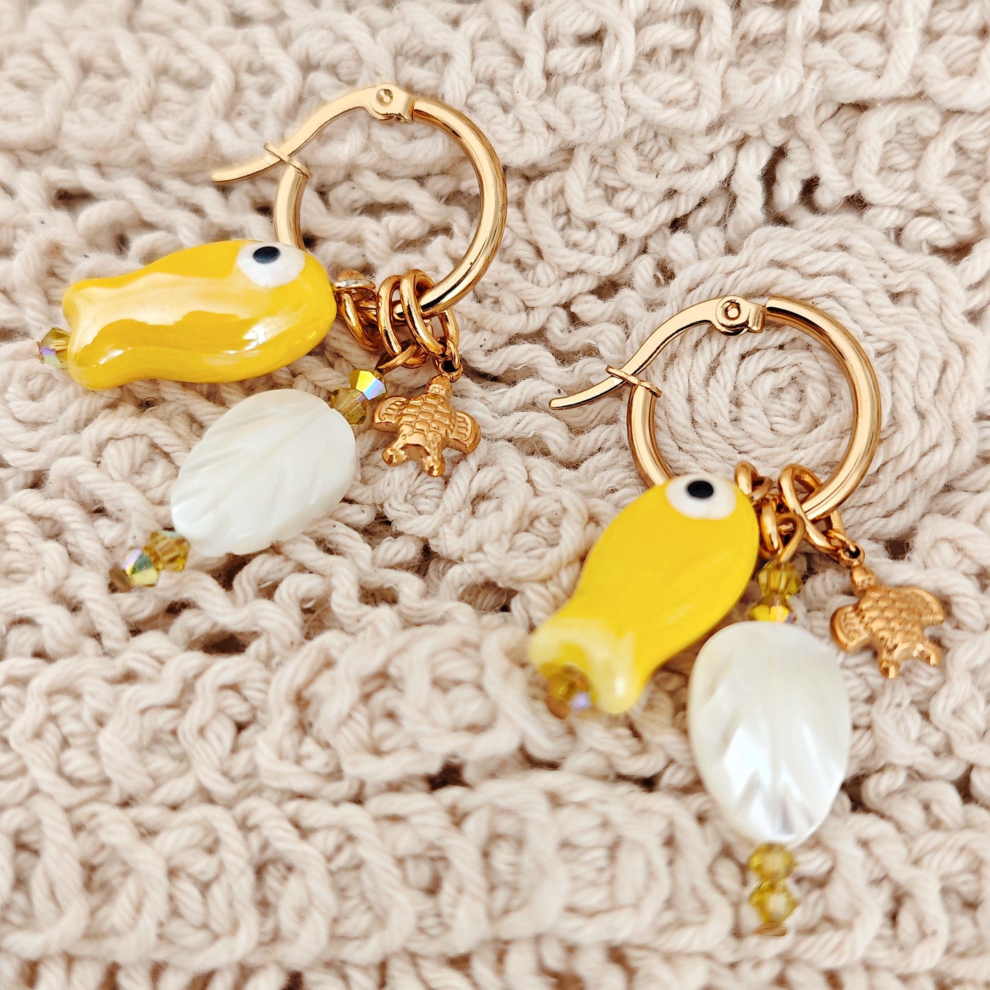 "Coastal Aura" earrings with ceramic fish, mother-of-pearl leaves, and turtles