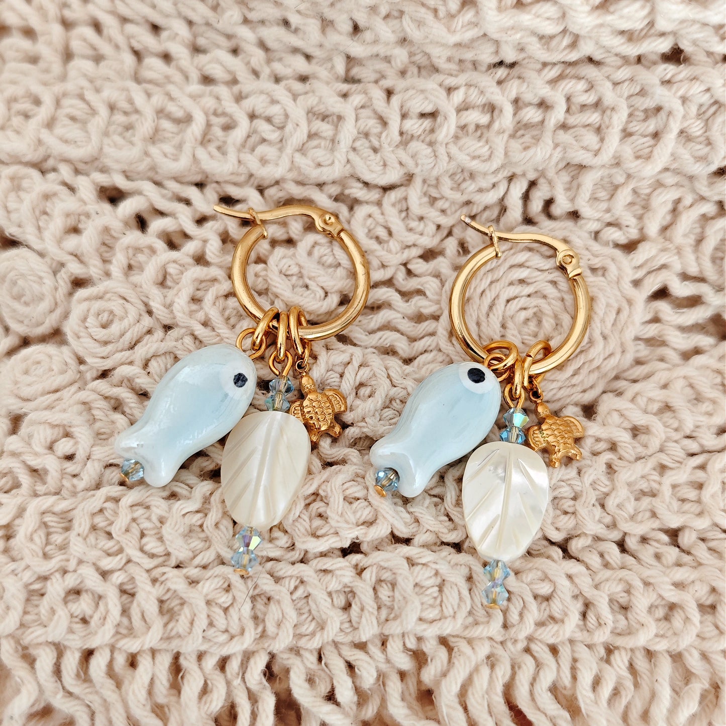 "Coastal Aura" earrings with ceramic fish, mother-of-pearl leaves, and turtles