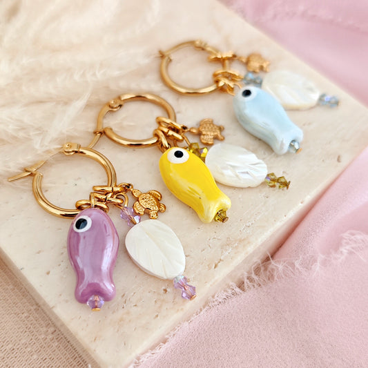 "Coastal Aura" earrings with ceramic fish, mother-of-pearl leaves, and turtles