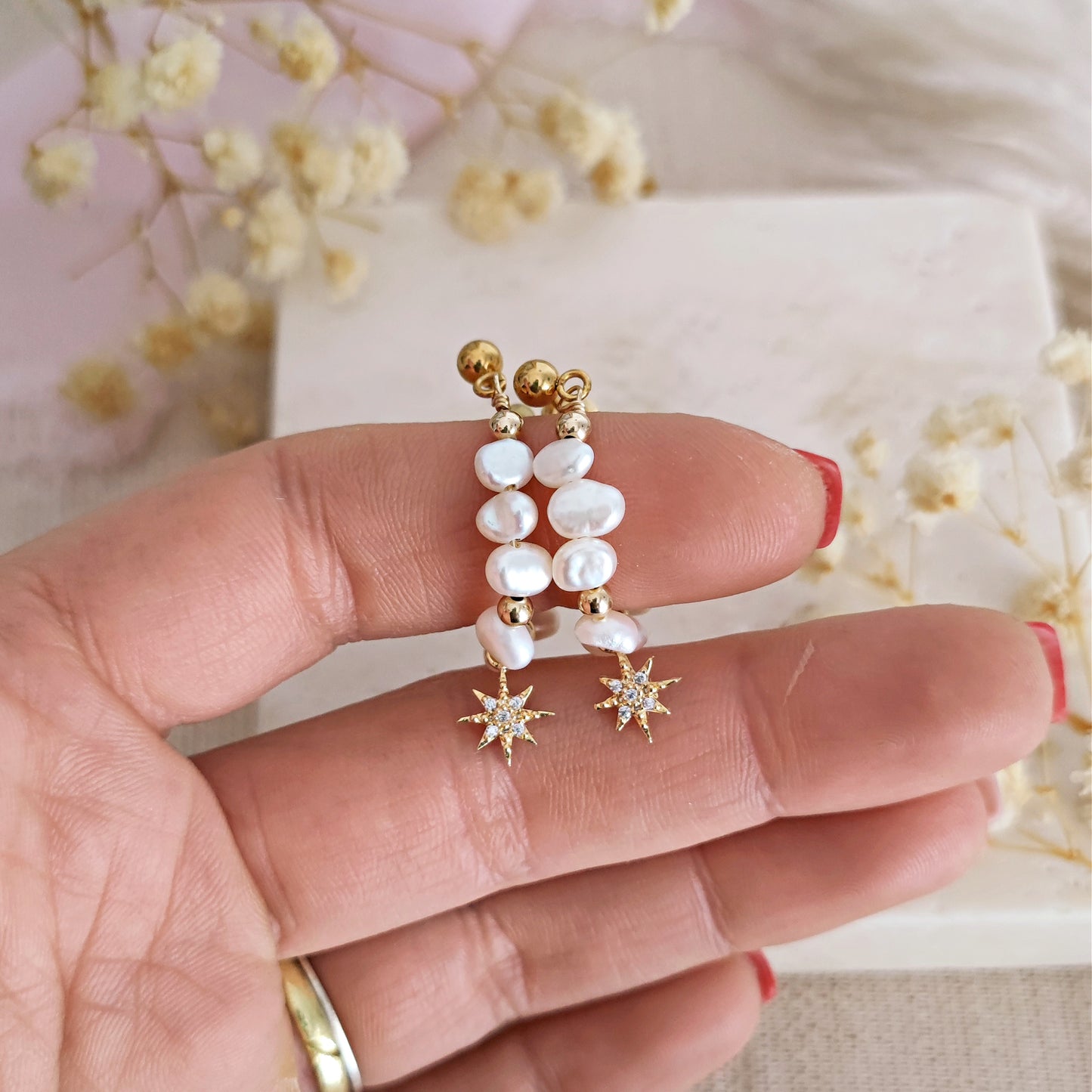 Earrings with freshwater pearls and north star // CALLULA